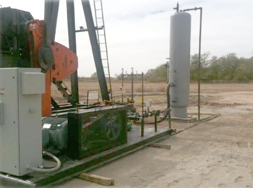 eliminate-workovers-big image of two wellsite operators walking the site